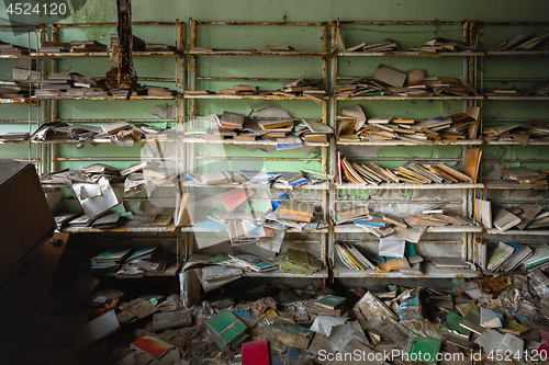 Image of Abandoned bookstore with shelves full of worn books