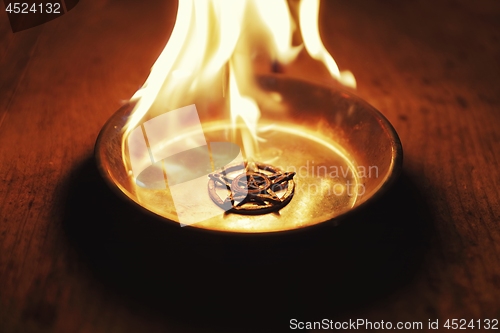 Image of Old pentagram burning in flames