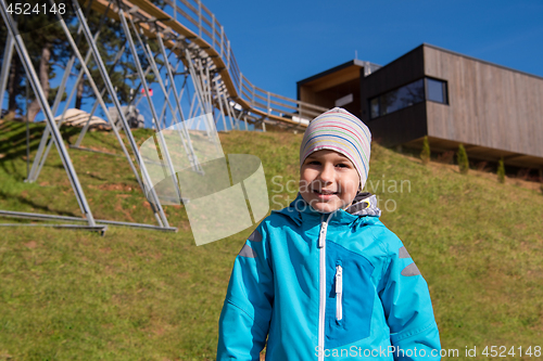 Image of portrait of a boy under alpine coaster