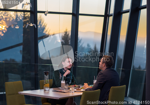 Image of loving couple enjoying romantic dinner