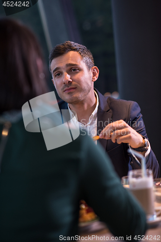 Image of loving couple enjoying romantic dinner