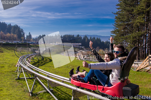 Image of couple driving on alpine coaster