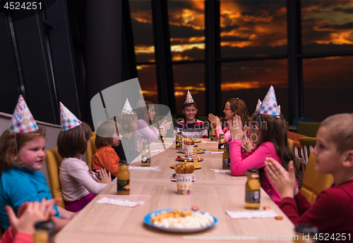 Image of young boy having birthday party