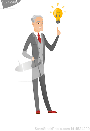 Image of Caucasian businessman pointing at idea lightbulb.