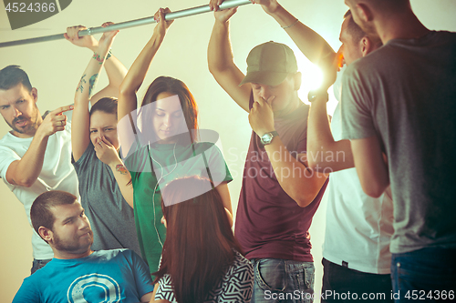 Image of Sweaty armpits. Sweaty man. Bus. Public transport. The unhappy people near man