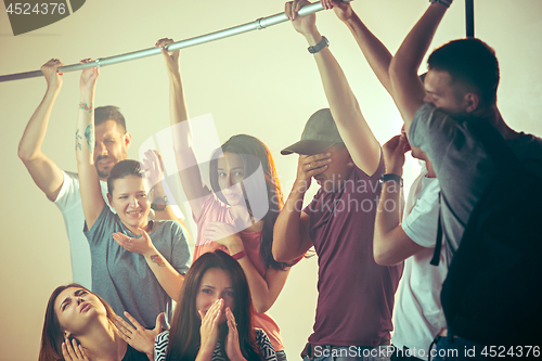 Image of Sweaty armpits. Sweaty man. Bus. Public transport. The unhappy people near man