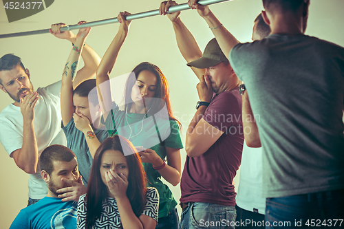 Image of Sweaty armpits. Sweaty man. Bus. Public transport. The unhappy people near man