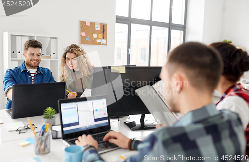 Image of creative team working on user interface at office