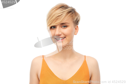 Image of portrait of smiling teenage girl over white