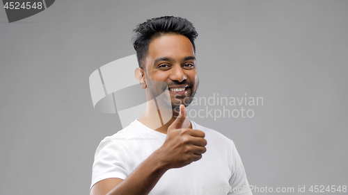 Image of happy indian man showing thumbs up