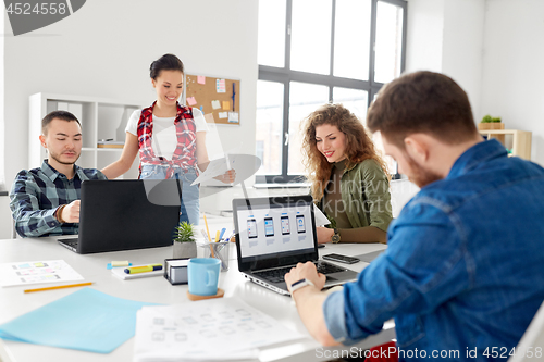 Image of creative team working on user interface at office