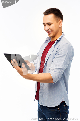 Image of happy young man with tablet computer