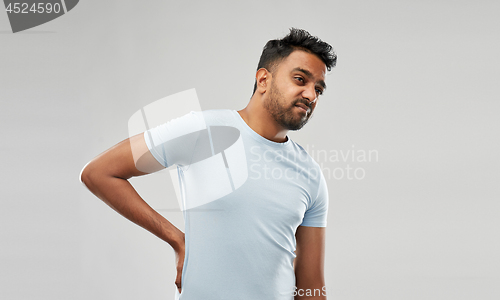 Image of indian man suffering from backache