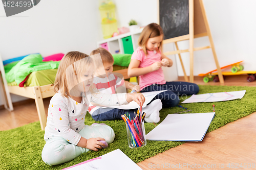 Image of children drawing and making crafts at home