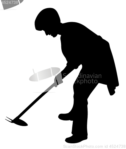 Image of Woman working in the garden with weeding hoe