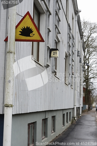 Image of traffic sign attention hedgehog on a house in Helsinki