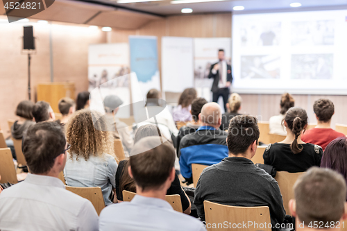 Image of Business speaker giving a talk at business conference event.