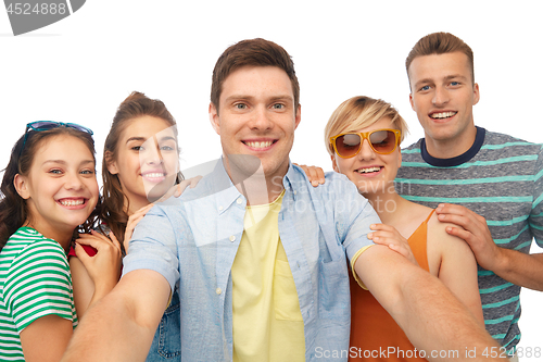 Image of happy friends taking selfie over white background