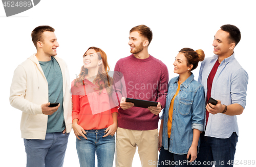 Image of friends with smartphones and tablet computer