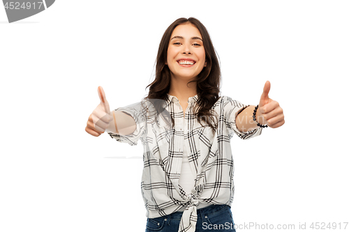 Image of young woman or teenage girls showing thumbs up