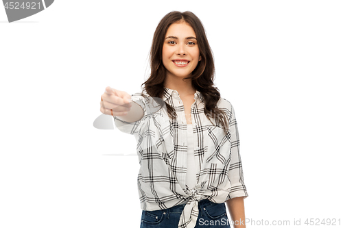 Image of young woman or teenage girl pointing finger at you