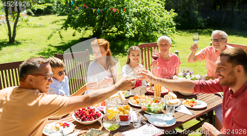 Image of family gathering at summer garden and celebration