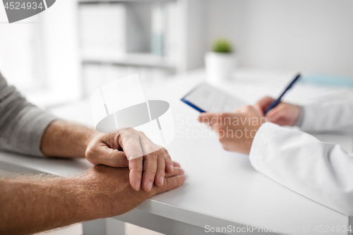 Image of close up of senior man and doctor at hospital