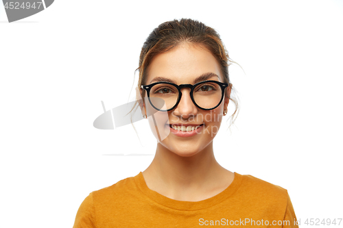 Image of smiling student girl in glasses over white