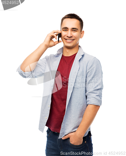 Image of happy young man calling on smartphone