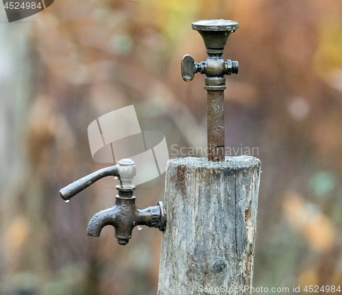 Image of Old Tap or Faucet in Rain