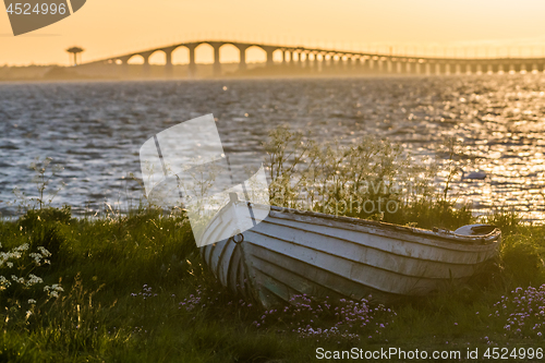 Image of The swedish Oland Bridge with an old rowing boat in the front