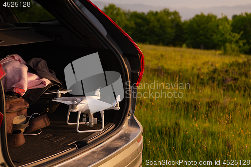 Image of drone ready for fly in suv trunk l