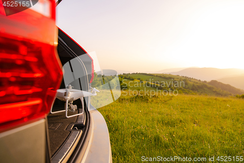 Image of drone ready for fly in suv trunk l