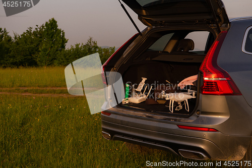 Image of drone ready for fly in suv trunk l