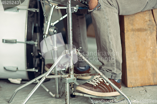 Image of Repetition of rock music band. drummer behind the drum set.