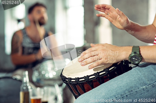 Image of Repetition of rock music band. drummer behind the drum set.