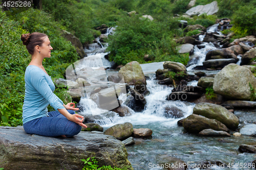 Image of Woman in Padmasana outdoors