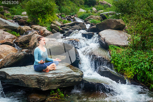 Image of Woman in Padmasana outdoors