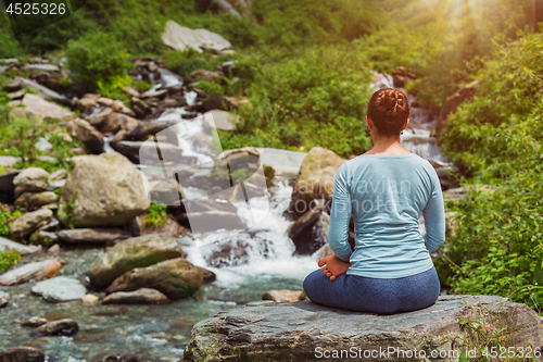 Image of Yoga outdoors - Padmasana asana lotus pose