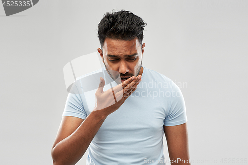 Image of unhealthy indian man coughing