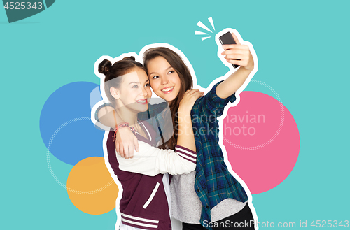 Image of happy teenage girls taking selfie with smartphone