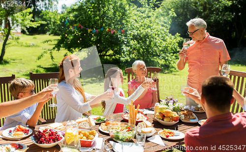 Image of family gathering at summer garden and celebration