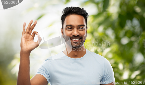 Image of happy indian man in t-shirt showing ok hand sign