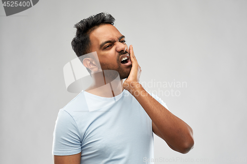 Image of indian man suffering from toothache