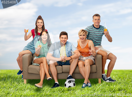 Image of friends or soccer fans with ball and drinks