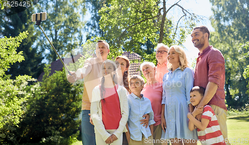 Image of happy family taking selfie in summer garden