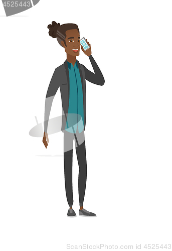 Image of African businessman talking on a mobile phone.