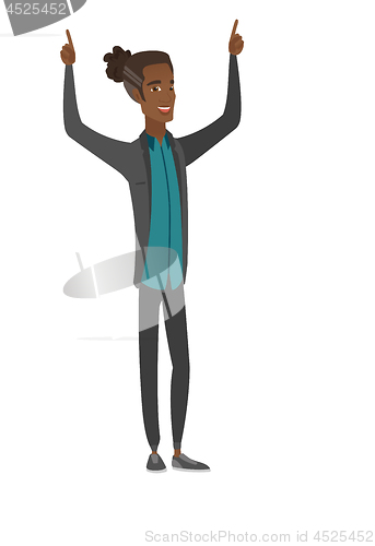 Image of African businessman standing with raised arms up.