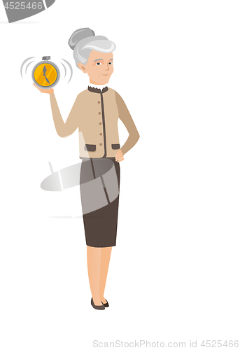 Image of Caucasian business woman holding alarm clock.