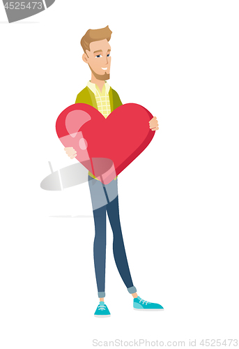 Image of Caucasian businessman holding a big red heart.
